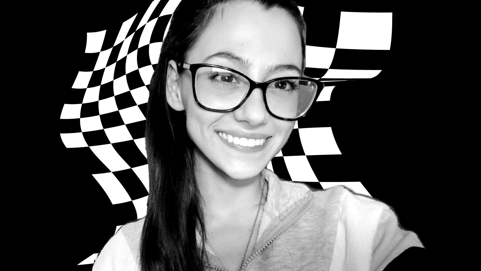 Black and white photo of woman in ponytail with glasses smiling over wavy checkered background